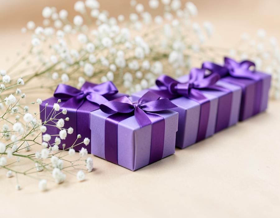 Row of purple gift boxes